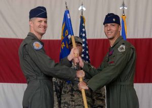 Col. Benjamin Bishop, 56th Operations Group commander, passes the guidon to Lt. Col. Matthew Vedder as he assumes command of the 63rd Fighter Squadron Aug. 1, 2016 at Luke Air Force Base, Ariz. The 63rd FS is scheduled to begin accepting F-35 Lightning II jets in March 2017 and will be joined by partner nation Turkey. (U.S. Air Force photo by Senior Airman Devante Williams)