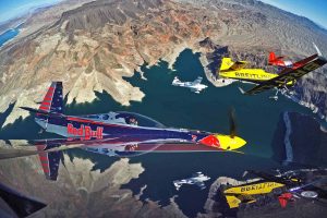 Pete McLeod of Canada flies in formation with Nigel Lamb of Great Britain, Martin Sonka of the Czech Republic and Kirby Chambliss of the United States during a Recon flight prior to the seventh stage of the Red Bull Air Race World Championship over the Hoover Dam in the Black Canyon of the Colorado River, on the border between the U.S. states of Arizona and Nevada on October 09, 2014.