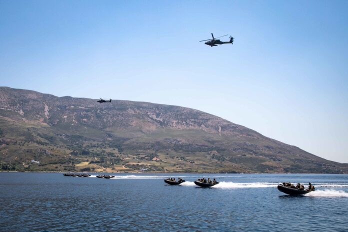 220517-N-PC065-1214 SKYROS ISLAND, Greece (May 17, 2022) – Hellenic Armed Forces conduct aerial and small boat operations along the coast of Skyros Island, Greece, during a joint training raid with the U.S. Marine Corps 22nd Marine Expeditionary Unit, deployed with the San Antonio-class amphibious transport dock ship USS Arlington (LPD 24), May 17, 2022. Arlington, with embarked 22nd Marine Expeditionary Unit, is participating in exercise Alexander the Great 2022 under the command and control of Task Force 61/2. Alexander the Great 22 strengthens interoperability and force readiness between the U.S., Greece, and Allied nations, enhancing strategic defense and partnership while promoting security and stability in the region.